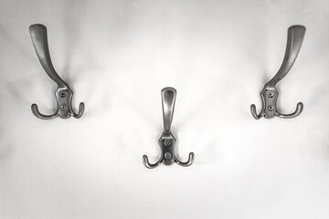 Iron hooks for clothes on the wall