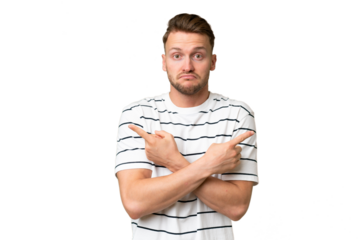 Young blonde caucasian man over isolated background pointing to the laterals having doubts