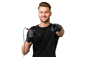 Tattoo artist caucasian man over isolated background pointing front with happy expression