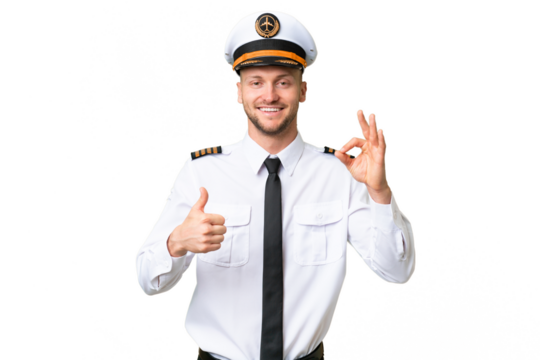 Airplane pilot man over isolated background showing ok sign and thumb up gesture