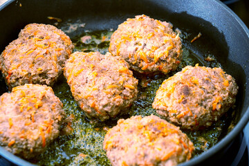 close-up, cooking meatballs in a frying pan