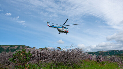 Fototapeta na wymiar Helicopter taking of the Uzon Caldera. Kronotsky Nature Reserve on Kamchatka.
