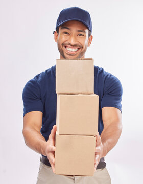 Delivery man, shipping boxes and portrait of a employee in studio with courier service and a smile. Box, supply chain and happiness of a worker with distribution, online shopping and mail services