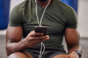 Fototapeta na wymiar Phone, music and man hands in gym for workout, search social media and online training podcast. Closeup sports person, smartphone and listening with earphones on mobile, exercise app and connection