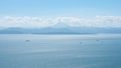 Avacha Bay of the Pacific Ocean mountains and blue skies. Kamchatka Peninsula.