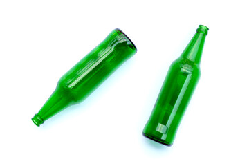 Green glass bottles on white background.