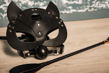Adult sex games. Kinky lifestyle. Bdsm outfit Leather cat mask with riding crop spank and gag ball