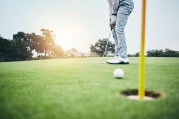Sports, golf hole and man with golfing club on course ground for game, practice and training for competition. Professional golfer, grass and male athlete hit ball for winning, score or tee stroke © Clayton D/peopleimages.com