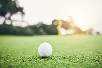 Sports, golf ball and practice on lawn of course for competition match, tournament and training. Target, challenge and games with equipment on grass field for leisure, recreation hobby and club