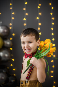 Portrait of a little boy with flowers