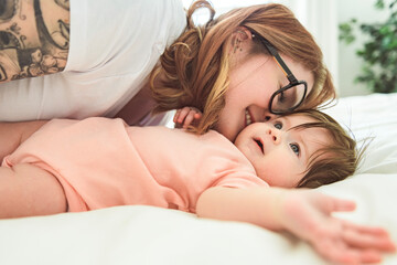 A Portrait of a beautiful mother, with her nursing baby