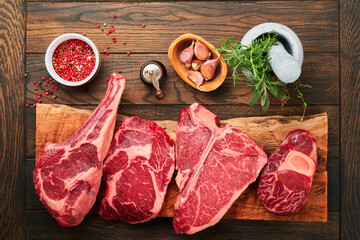 Raw prime steaks. Variety of fresh black angus prime meat steaks T-bone, New York, Ribeye,...