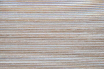 Seamless pattern of even lines on white. Beige background color.
