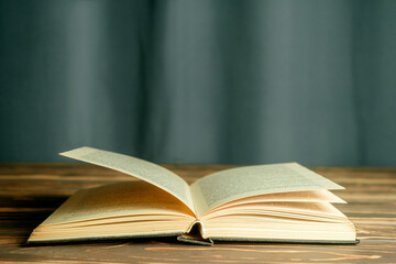 An open book of a student on the table. Book, knowledge, training