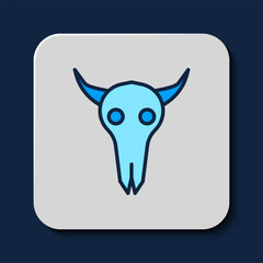 Filled outline Buffalo skull icon isolated on blue background. Vector