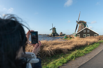 Tourists traveling in the windmill village