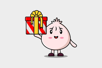 Cute cartoon Dim sum character holding gift box in vector icon illustration