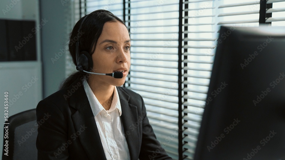 Poster competent female operator working on computer and talking with clients. concept relevant to both cal