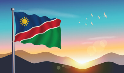 Namibia flag with mountains and morning sun in background