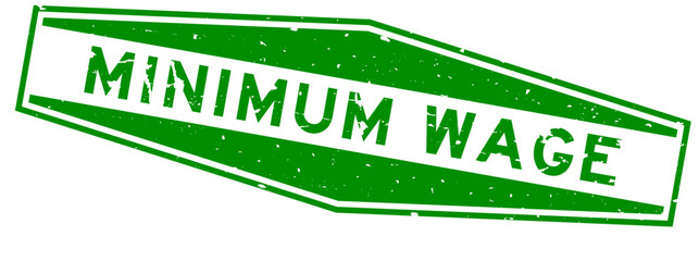 Grunge green minimum wage word hexagon rubber seal stamp on white background