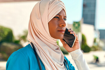 Muslim doctor outside near the hospital