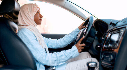 Muslim woman in the car