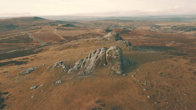 Aerial drone shot of Hay Tor rock monolith in Dartmoor National Park, Devon, UK