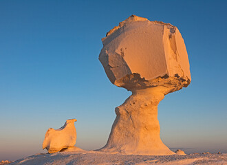 Barren desert landscape in hot climate with rock formation