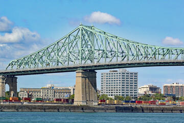 Naklejka premium Montreal cityscape as seen from the river edge