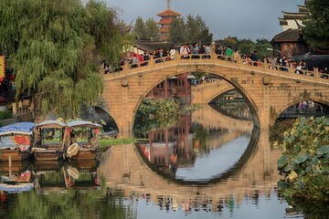Visitors crowd across a traditional bridge in a Chinese ancient watertown near Shanghai.