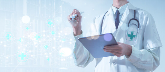 Telemedicine, connections to online medical networks, and the concept of global health. Stethoscope and laptop computer with internet health network connection technologies on a city background.