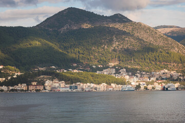 View of Igoumenitsa city harbor, with passenger port, ferry terminal, mountains and Ionian sea, Epirus, Thesprotia, Greece in a summer sunny day with blue sky