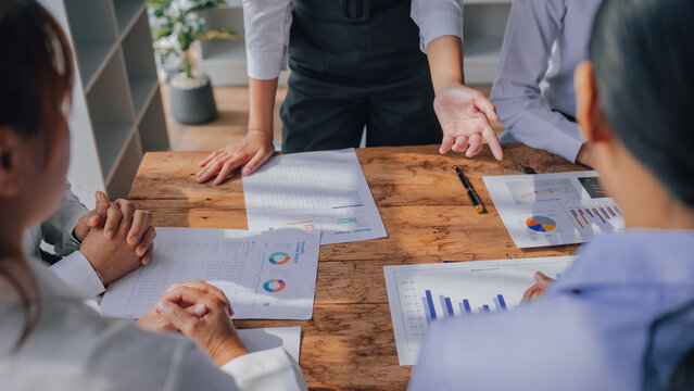 Attractive business people at meeting, Leadership vision, collaboration and teamwork of a business team in an office work meeting. Asia female hands close up.