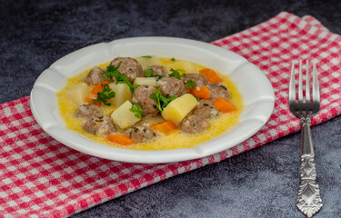 Seasoned soup with meatballs with vegetables. Turkish name; sulu kofte, eksili kofte, terbiyeli kofte)
