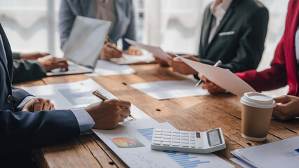 Team of lawyers and tax auditors brainstorming together and calculating the balance sheet and historical financial accounts of the company and shareholders. to detect mistakes and prevent bribery