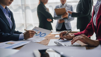 Team of lawyers and tax auditors brainstorming together and calculating the balance sheet and...