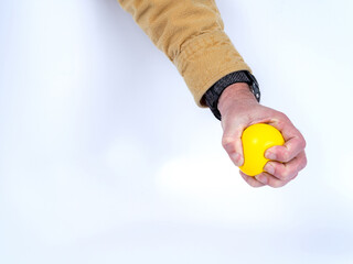 Stress relief with a yellow rubber ball
