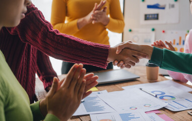 Shaking hands, Employees of the company receive auditing of accounting information. Help check...