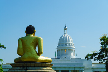 Buddha looks at the white capitol. Colombo Municipal Council 