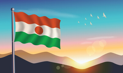 Niger flag with mountains and morning sun in background