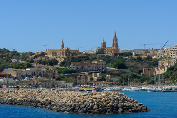 The breakwater at the entrance to Mgarr Harbour, Gozo.