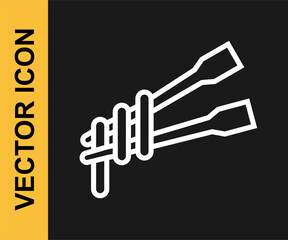Fototapeta premium White line Food chopsticks with noodles icon isolated on black background. Wooden Korean sticks for Asian dishes. Oriental utensils. Vector