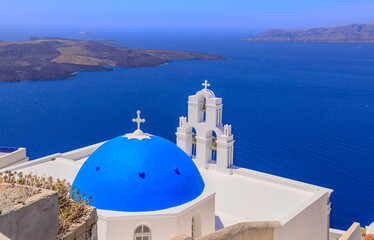 Fototapeta na wymiar TheThree Bells of Fira, a Greek Catholic church in Santorini, member of the Cyclades group of islands in Greece.