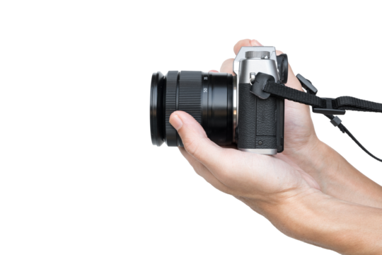 Hand holding vintage camera shooting side view isolated on transparent background