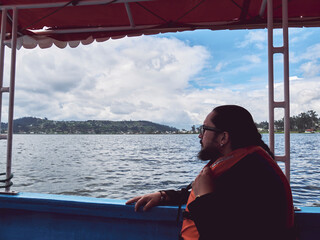 Enjoying a Peaceful Day on the Lake: Man in a Life Vest