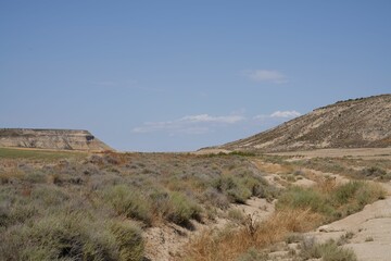Fototapeta na wymiar Deserted area landscape with bare hills