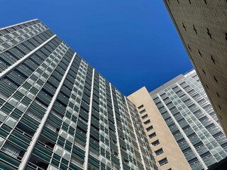 Low-angle of sunlit skyscrapers against clear sky