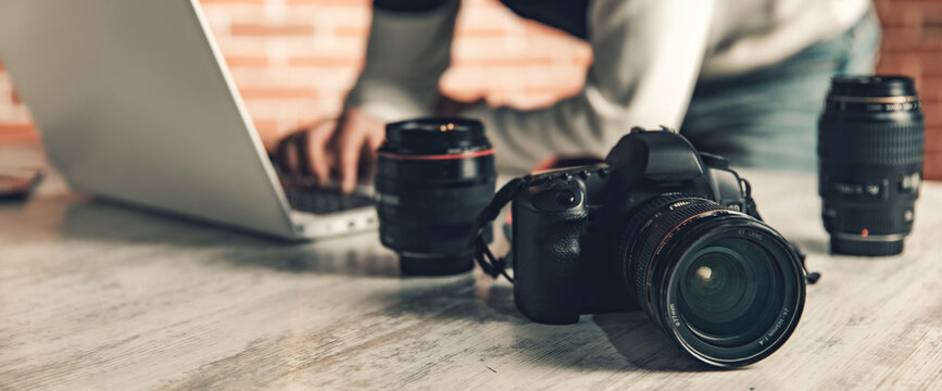 photographer hand camera working in desk