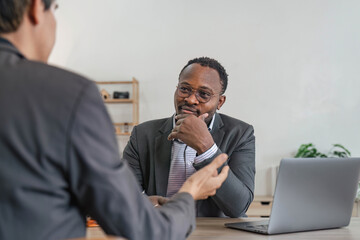 Business team and lawyers discussing contract papers sitting at the table. Concepts of law, advice,...