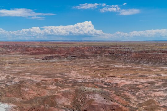 Painted Desert (Badlands) under blue cloudy sky in the Petrified Forest National Park, Arizona